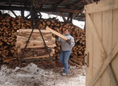 Jessica Boone loading wood cart